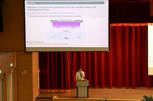a student presenting their research in the competition.(Open new window/jpg file)Image