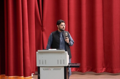 an international student participant giving a presentation.(Open new window/jpg file)Image
