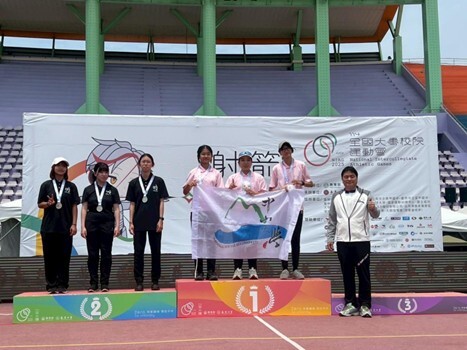 Photo of the women's compound archery team posing with their silver medals.(Open new window/jpg file)Image