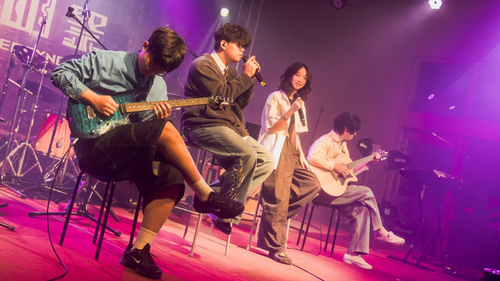 Vibrant stage performances showcase student collaboration, youthful energy, and campus cohesion.(Open new window/png file)Image