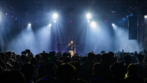 Vibrant stage performances showcase student collaboration, youthful energy, and campus cohesion.(Open new window/png file)Image